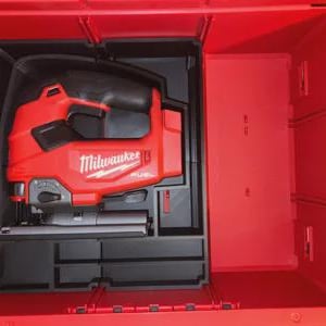 May include: A red Milwaukee FUEL jigsaw tool in a red storage case. The jigsaw is black and red with the Milwaukee logo. The case is open, revealing the tool and storage compartments.