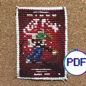 May include: A cross-stitch pattern featuring a red background with a white border. The pattern depicts a group of four people wearing colorful clothing and standing in a circle. The text "It's the most wonderful time of the year" is written in white at the top of the pattern.