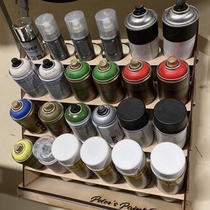 24 cans of spray paint.
Max size of the cans is 70 mm
Material is 4 mm MDF