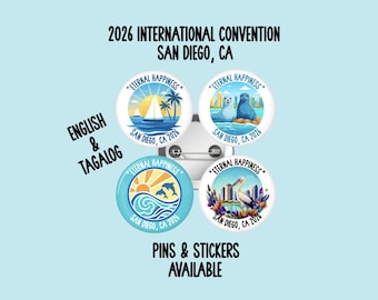 May include: Four circular pin-back buttons featuring colorful illustrations of San Diego, California, with the text 2026 INTERNATIONAL CONVENTION SAN DIEGO, CA, ETERNAL HAPPINESS, ENGLISH & TAGALOG, and PINS & STICKERS AVAILABLE printed on the light blue background.