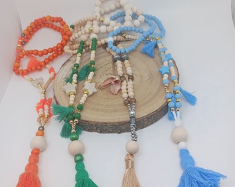 Women's long necklaces with pompoms