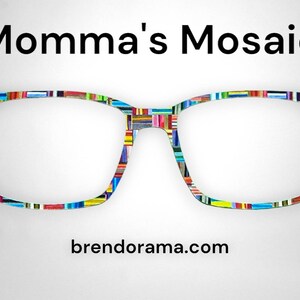 May include: A pair of colorful eyeglasses with a mosaic pattern on the frames. The brand name "Momma's Mosaic" is above the glasses and the website "brendorama.com" is below.