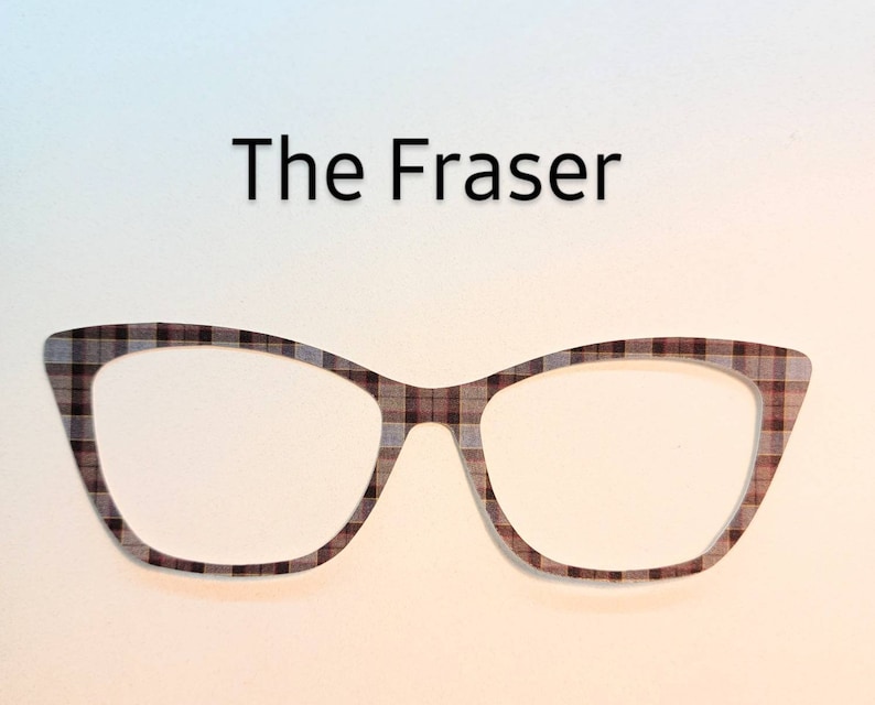 May include: A pair of black and brown plaid cat-eye glasses with the text "The Fraser" above them.