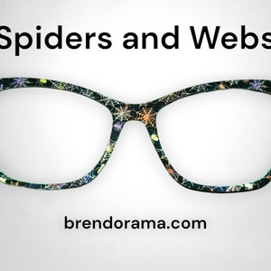 Spiders and Webs - batik purples, oranges, yellows over a black background
