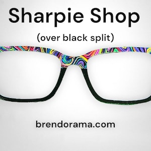 May include: A pair of black framed glasses with a colorful, abstract design on the top half of the frame. The text "Sharpie Shop (over black split)" is above the glasses and "brendorama.com" is below the glasses.