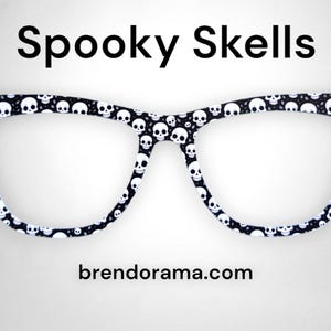 Spooky Skells - basic skeleton heads on black background
