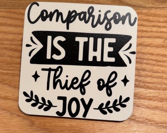 Posavasos con cita inspiradora: La comparación es la ladrona de la alegría