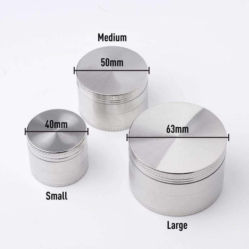 May include: Three silver metal grinders of different sizes. The smallest grinder is 40mm in diameter, the medium grinder is 50mm in diameter, and the largest grinder is 63mm in diameter.