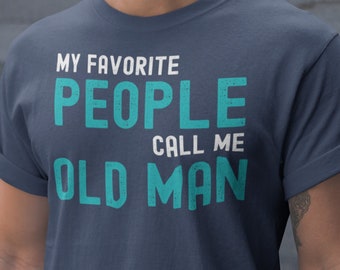 May include: A navy blue t-shirt with the text "My favourite people call me old man" in white and teal lettering.