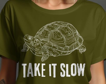 May include: A green t-shirt with a white outline of a turtle and the text "Take it slow".