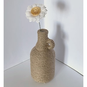 Bottiglia in corda con fiore