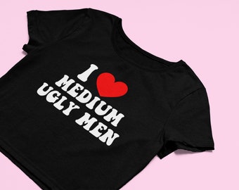 May include: Black cropped t-shirt with white text that reads "I ♥ MEDIUM UGLY MEN".