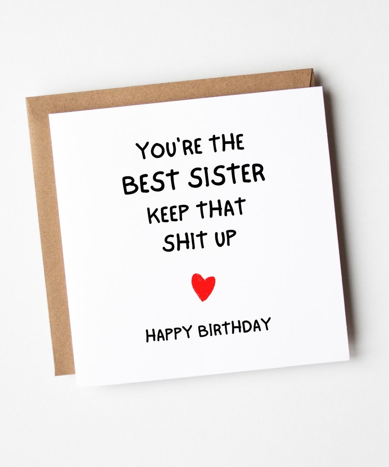 May include: A white card with black text that reads "You're the best sister keep that shit up" with a red heart and the words "Happy Birthday" below.