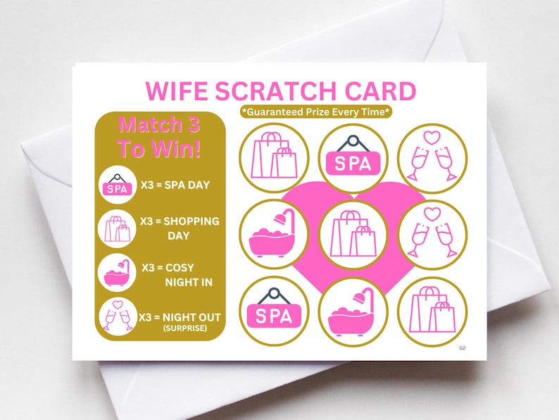 May include: A pink and gold scratch-off card with the text "Wife Scratch Card" and "Match 3 To Win!"  The card has nine squares with different icons, including a spa, shopping bags, a bathtub, and champagne glasses. The text "Guaranteed Prize Every Time" is also included.