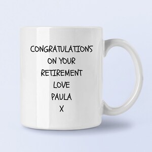 May include: White ceramic mug with black text that reads "Congratulations on your retirement Love Paula X".