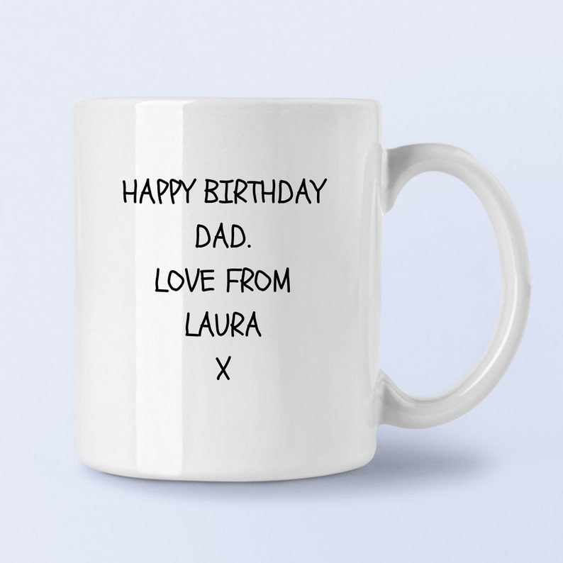 May include: White ceramic mug with black text that reads "Happy Birthday Dad. Love from Laura X".