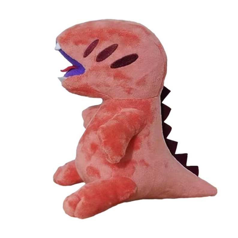 Pu&ograve; includere: Un giocattolo di peluche a forma di dinosauro rosa con la lingua viola che sporge. Il dinosauro ha una coda spinosa viola e nera.