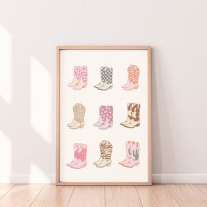 May include: A printable art print featuring nine different pairs of cowboy boots with various patterns, including hearts, stars, and animal prints. The boots are all pink, white, and brown.
