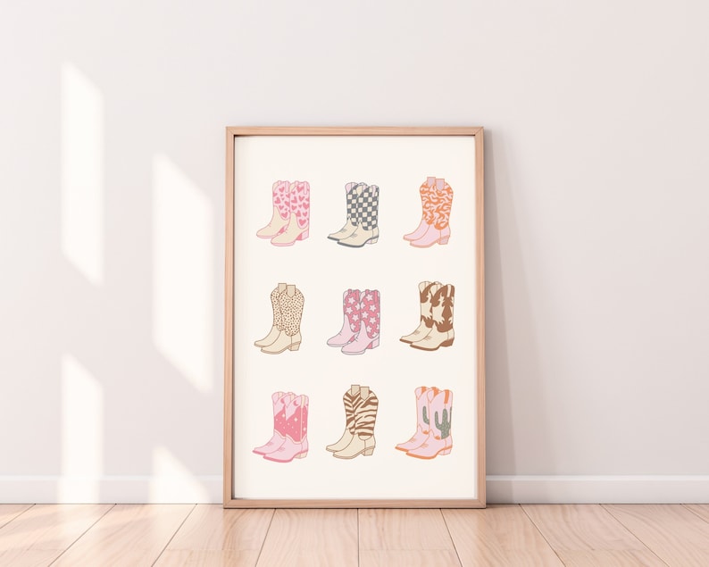 May include: A printable art print featuring nine different pairs of cowboy boots with various patterns, including hearts, stars, and animal prints. The boots are all pink, white, and brown.