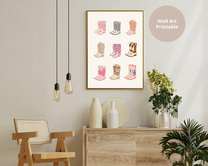 May include: A printable wall art print featuring a collection of 12 pink, white, and brown cowboy boots with various patterns. The boots are arranged in a grid pattern on a white background.
