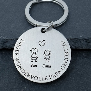 Personalized keychain with engraving for dad - "This dad belongs to ..."