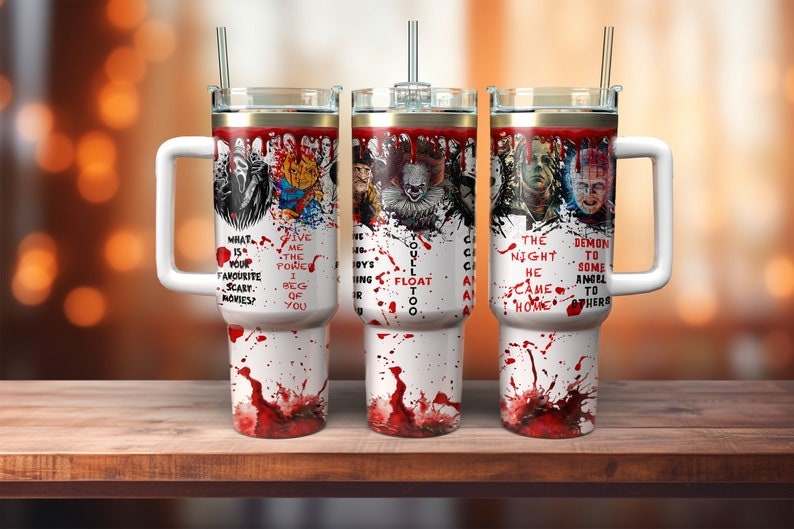 May include: Three white insulated tumblers with handles, each featuring horror movie characters and blood splatter designs. Text includes phrases like "What is your favorite scary movies?" and "You'll float too."