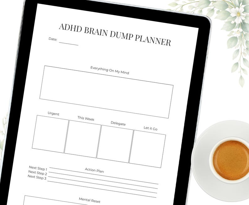 May include: A digital planner on a tablet with the text "ADHD BRAIN DUMP PLANNER." The planner includes sections for "Everything On My Mind," "Urgent," "This Week," "Delegate," and "Let it Go." A cup of coffee sits on a saucer in the bottom right corner.