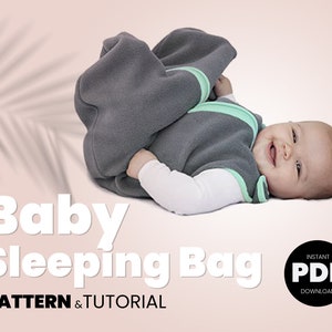 May include: A gray baby sleeping bag with a green zipper and trim. The sleeping bag is laid out on a pink surface. The text "Baby Sleeping Bag" is in white letters on a pink background. The text "PATTERN & TUTORIAL" is in black letters on a pink background. The text "INSTANT PDF DOWNLOAD" is in white letters on a black circle.