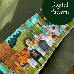 Könnte beinhalten: Eine Filz-Beschäftigungsbuchseite mit einer Waldszene, einem Tiger, einer Eule und verschiedenen Formen. Die Seite enthält einen dunkelgrünen Kreis mit dem weißen Text Digital Pattern. Die Szene besteht aus geschichteten Filzteilen in Grün-, Braun-, Blau- und Orangetönen mit gestickten Details und kleinen Knöpfen an der Tigerfigur.