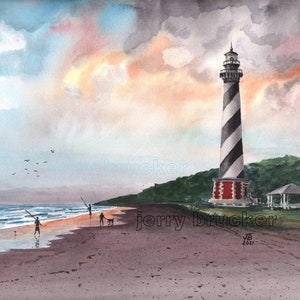 May include: A watercolor painting of a black and white striped lighthouse on a beach with a group of people fishing in the foreground. The sky is a soft blue with pink and orange clouds. The painting is signed "jerry brucker" and dated "2021".