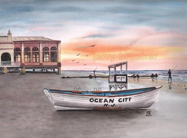May include: A white wooden boat with the words "Ocean City N.J." painted on the side, sitting on a sandy beach with a lifeguard stand in the background. The sky is a vibrant orange and pink.