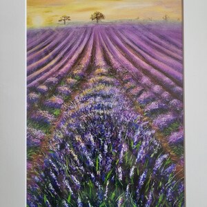 May include: A painting of a field of lavender flowers in bloom. The field is in rows and the flowers are a vibrant purple color. The sky is a soft yellow and there are two trees in the distance. The painting is signed "Nadia Conde" in the bottom right corner.