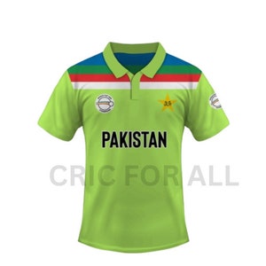May include: Green and white cricket jersey with a star and the word "PAKISTAN" on the front. The jersey has red, white, and blue stripes on the collar and shoulders. The text "CRIC FOR ALL" is printed on the bottom of the jersey.