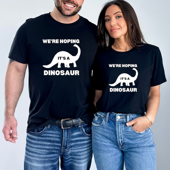 We're Hoping It's A Dinosaur Pregnancy T-Shirt We're Hoping It's A Dinosaur Pregnancy T-Shirt