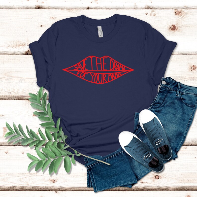 May include: A navy blue t-shirt with a red graphic of a pair of lips with the text "Save the drama for your mama" inside the lips.