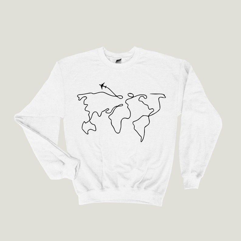 May include: White sweatshirt with a black line drawing of the world map and two airplanes flying above it.