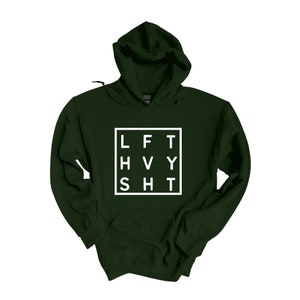 May include: A dark green hooded sweatshirt with a white square graphic that says "LFT HVY SHT" in a grid pattern.