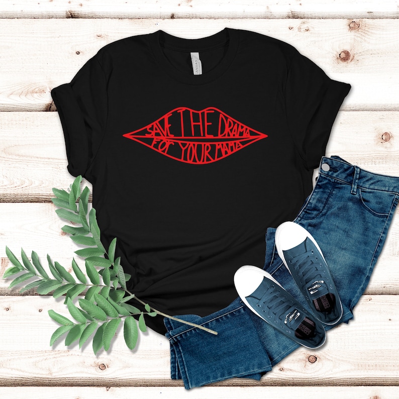 May include: Black t-shirt with a red graphic of a pair of lips with the text "Save the drama for your mama" inside.