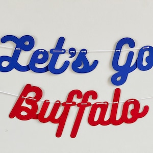 May include: A blue and red banner with the text "Let's Go Buffalo" in a cursive font.
