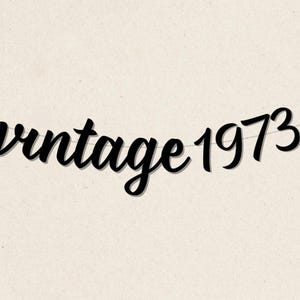 May include: Black and white banner with the text "vintage 1973" in a cursive font.