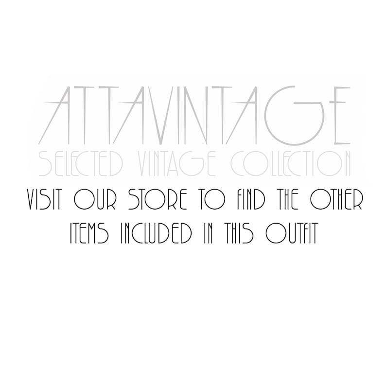 May include: A white graphic with black text that reads ATTAVINTAGE SELECTED VINTAGE COLLECTION. Below this, the text reads VISIT OUR STORE TO FIND THE OTHER ITEMS INCLUDED IN THIS OUTFIT. The lettering is in a clean, sans-serif, stylized font.