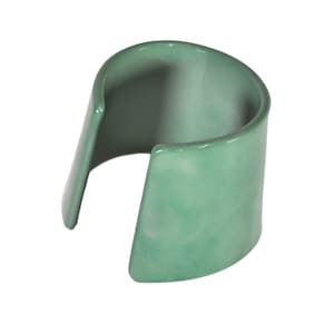 May include: A green plastic bangle bracelet with a marbled effect.