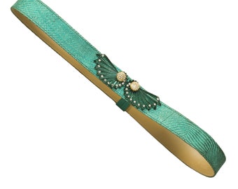 Conjunto de cinturón y pendientes de clip Valentino Night vintage: accesorios con pedrería verde.