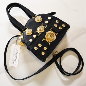 GIANNI VERSACE handbags, iconic VERSACE mini bag in black satin from the 90s with gold Medusa medallions and strass, luxury archive piece.