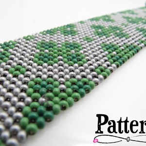 May include: A wide beaded bracelet featuring a pattern of green and silver beads. The bracelet is made of small, round beads woven together. The word "Pattern" is displayed in a decorative font at the bottom right.