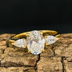 Oval Lab Grown Diamond Engagement Ring: Three Stone Pear Accents
