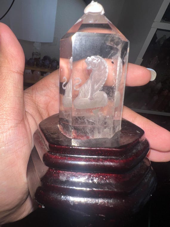 Tiger clear quartz 3d carving with holder
