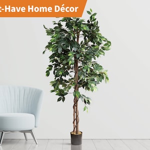 May include: A green artificial ficus tree with a brown twisted trunk in a black pot. The tree is in front of a white wall and a light blue armchair.