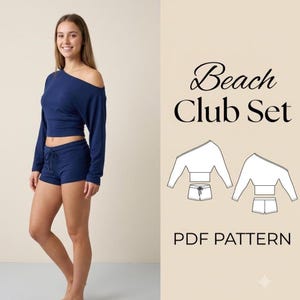 May include: A navy blue two-piece set consisting of a long-sleeved, one-shoulder crop top and matching shorts with a drawstring waist. The text Beach Club Set PDF PATTERN is displayed alongside a white line drawing of the garment pieces.