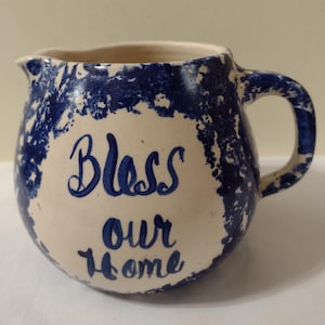 Vintage Pottery Pitcher With Handle. Color Beige, And Blue. Size 5&quot; tall, 4&quot; Wide Top. Says Bless Our Home. Made In U.S.A.